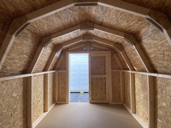 inside of rounded shed with wood walls