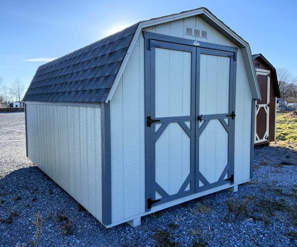 cream colored shed with grey trimming