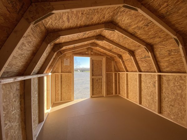 inside of rounded shed with wood walls