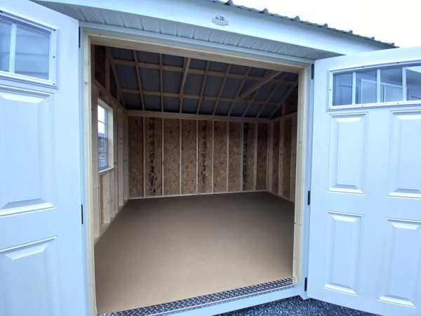 inside of shed with 2 white entry doors