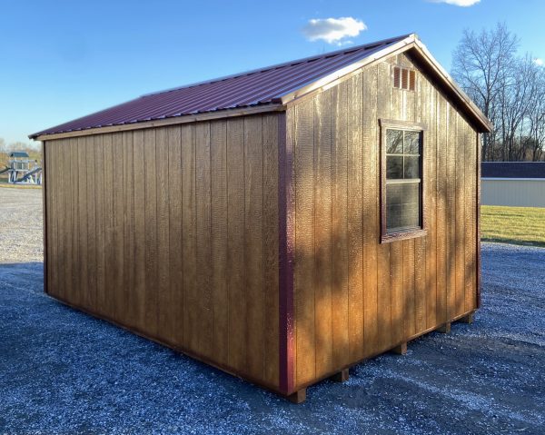 brown shed with red trimming
