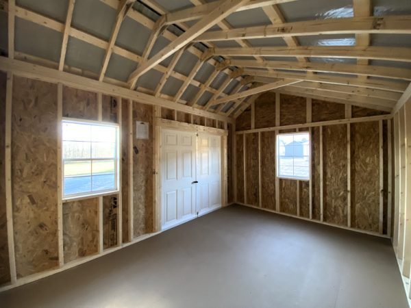Large inside of shed with wood walls