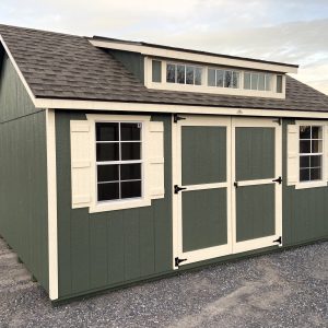 Green shed with white trimming
