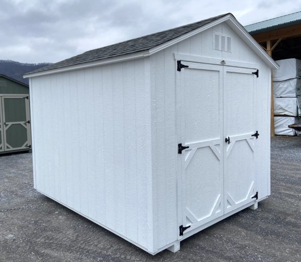 white shed with black roof