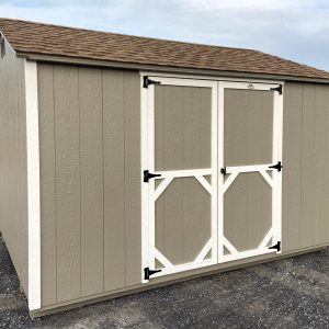 light brown shed with white trim