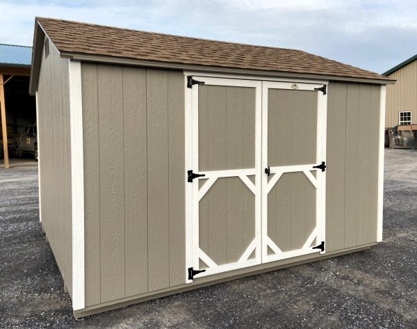 light brown shed with white trim