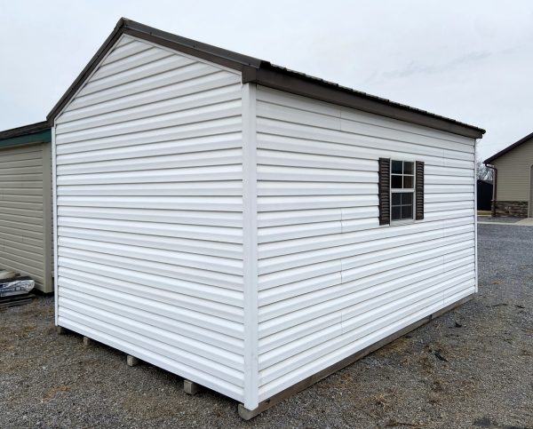 White Shed with Black Roof and Small Window